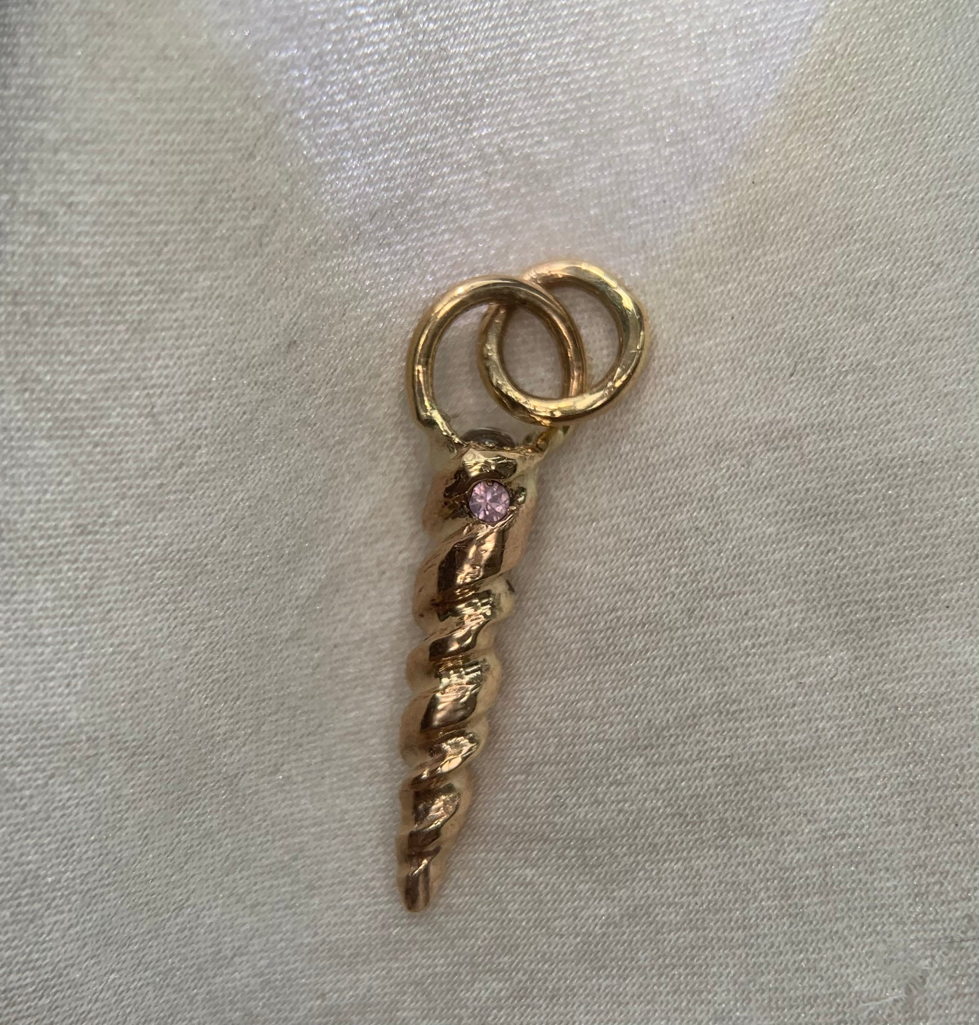 gold unicorn horn with moonstone pendant